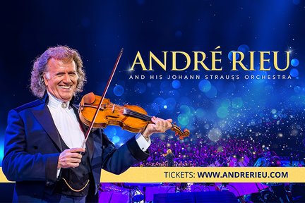 Der berühmte Geiger André Rieu trägt einen eleganten Anzug und spielt leidenschaftlich auf seiner Violine vor einer festlichen Kulisse.